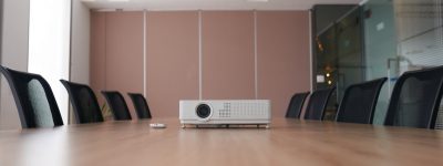 Projector on empty table in meeting room
